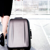 carrying-luggage carrying luggage