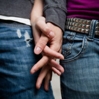 young-couple young couple holding hands