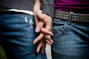 young couple holding hands young couple holding hands